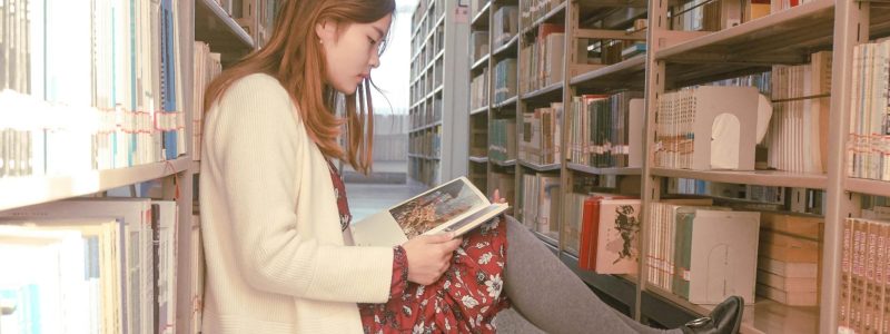 photo of a woman reading book